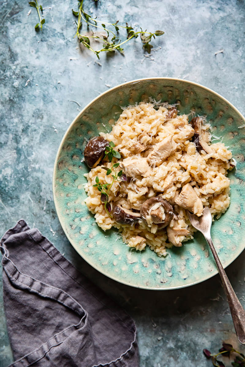 Top down view of a bowl of Chicken Risotto with Mushrooms and Thyme