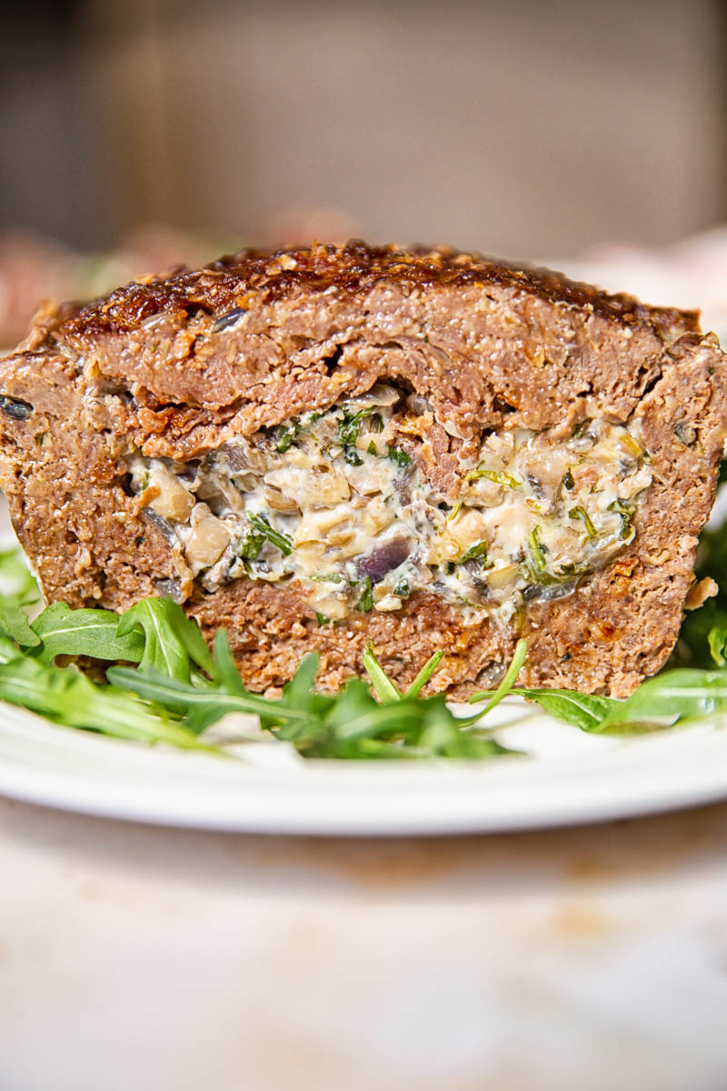 Meatloaf stuffed with creamed mushrooms with herbs and garlic. 