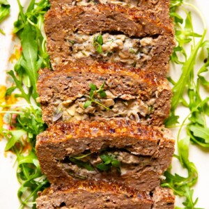 Meatloaf stuffed with creamed mushrooms with herbs and garlic.