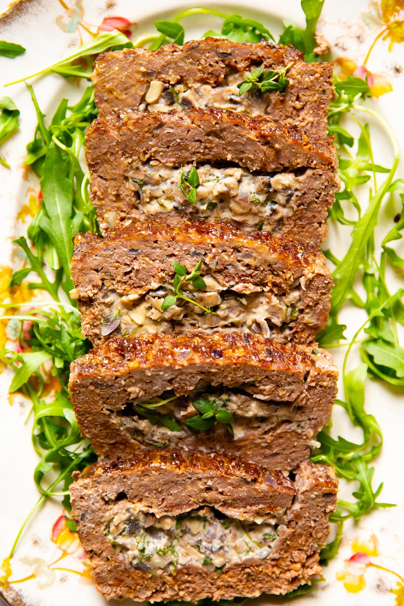 Meatloaf stuffed with creamed mushrooms with herbs and garlic.