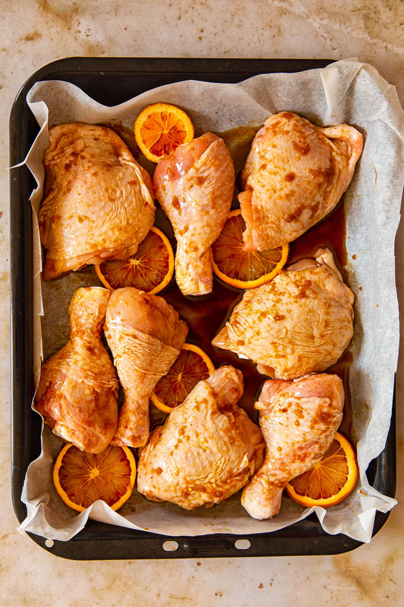 Unbaked honey soy chicken in roasting pan 