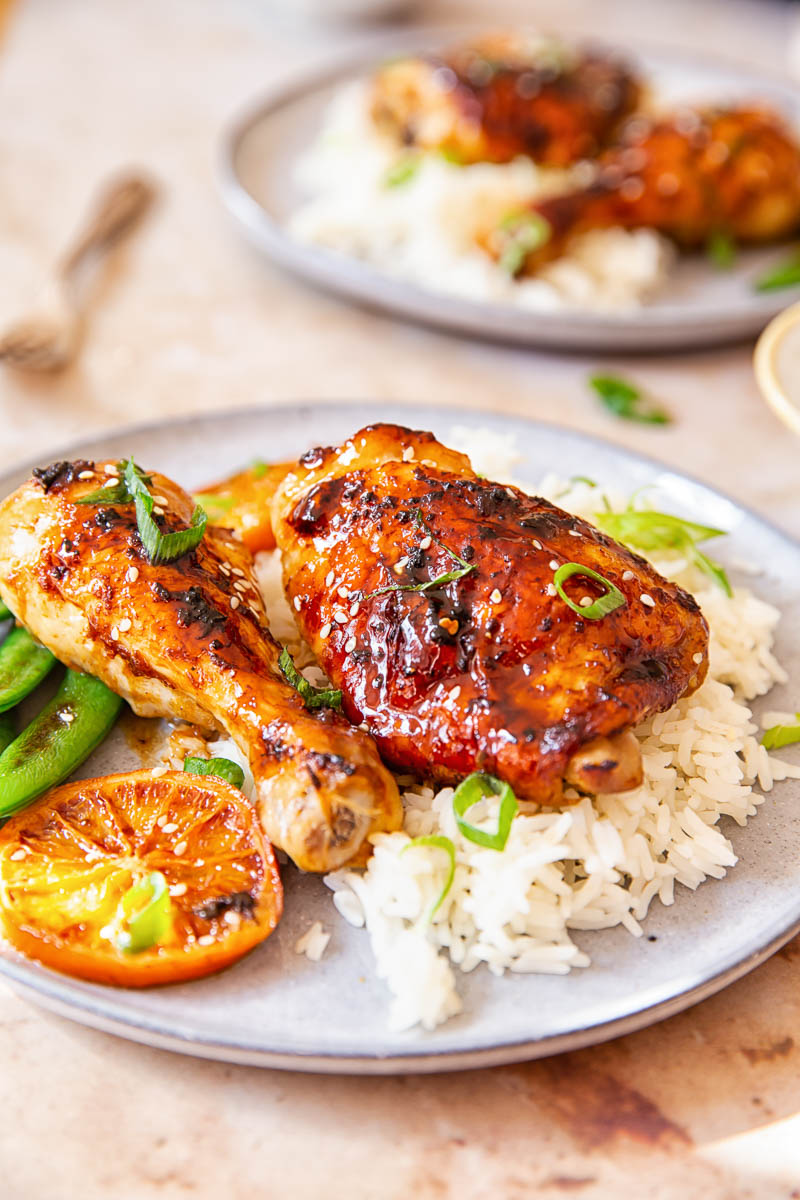 Honey Soy Chicken sprinkled with green onion and sesame seeds over white rice.