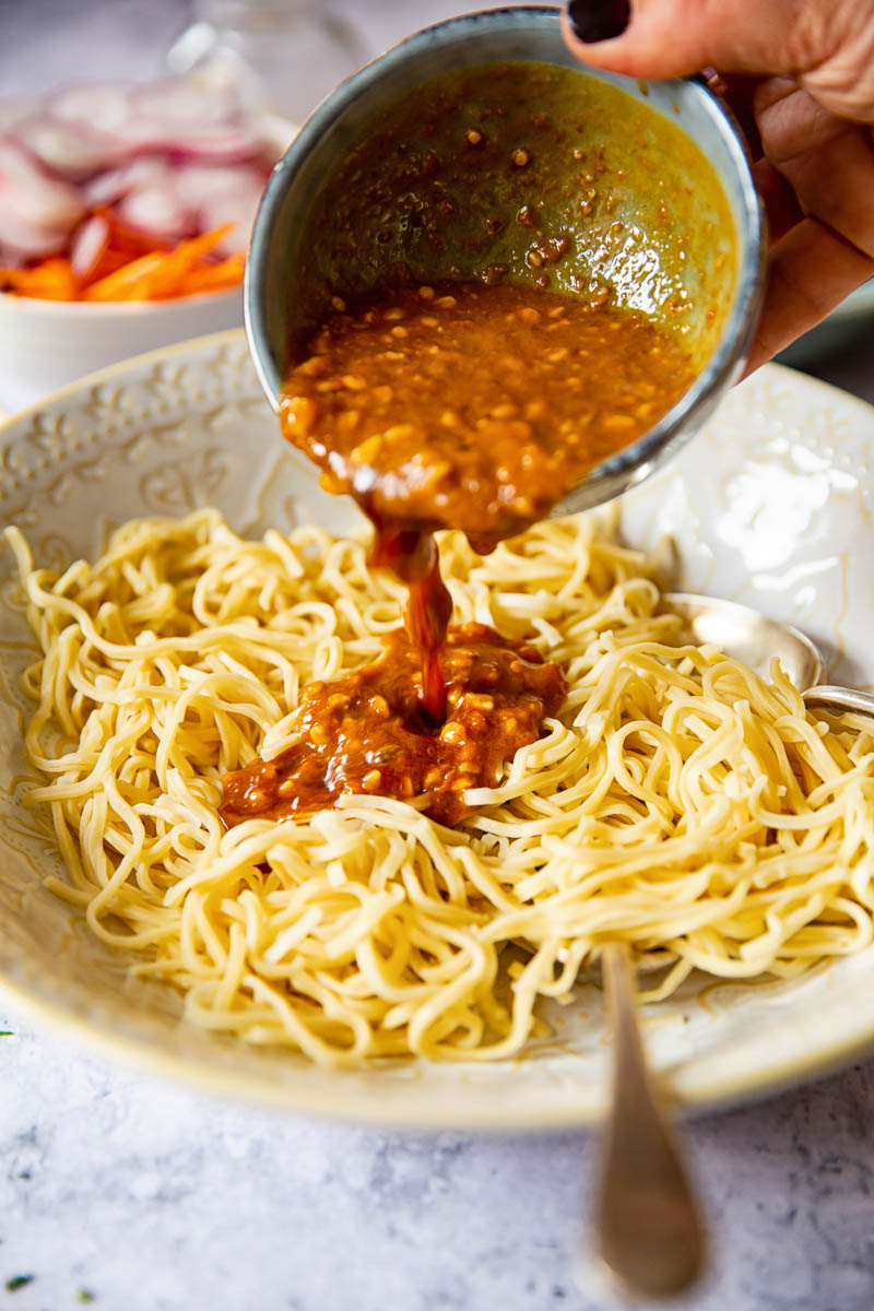 Peanut Dressing poured over Asian noodles