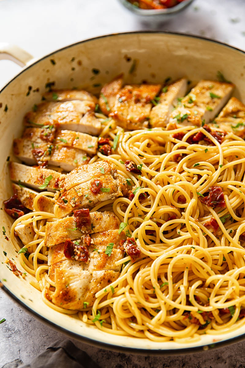 Spaghetti tossed with sun-dried tomatoes, garlic and chillies and sliced chicken breasts. 