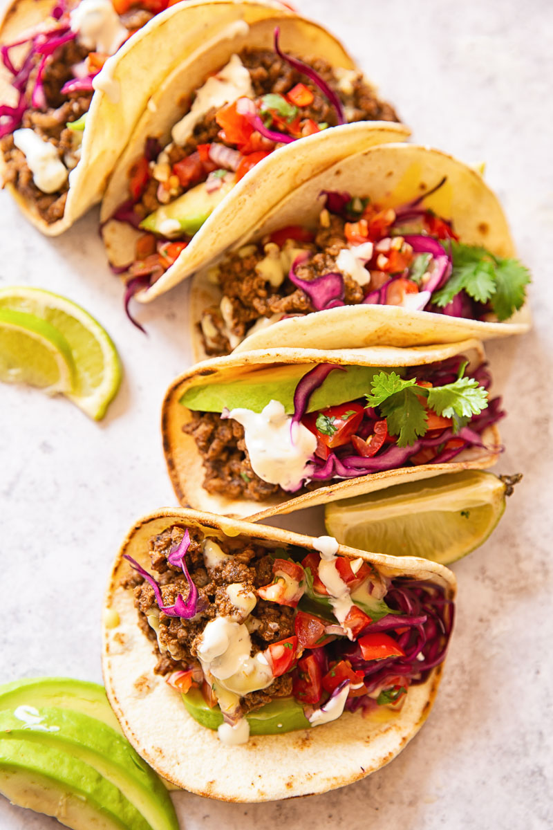 Beef Tacos topped with pico de gallo and slaw