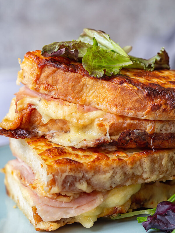 Croque Monsieur Sandwiches stacked on a plate