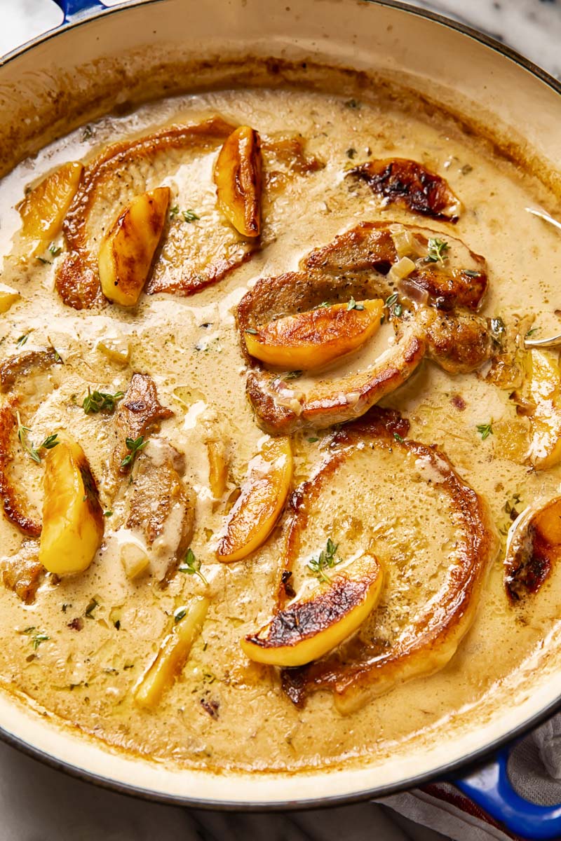 Pork chops and apples in creamy apple cider sauce