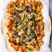 Fries loaded with steak, green peppers and melted cheese.