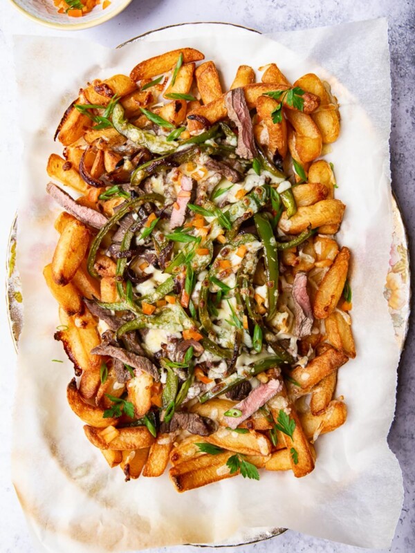Fries loaded with steak, green peppers and melted cheese.