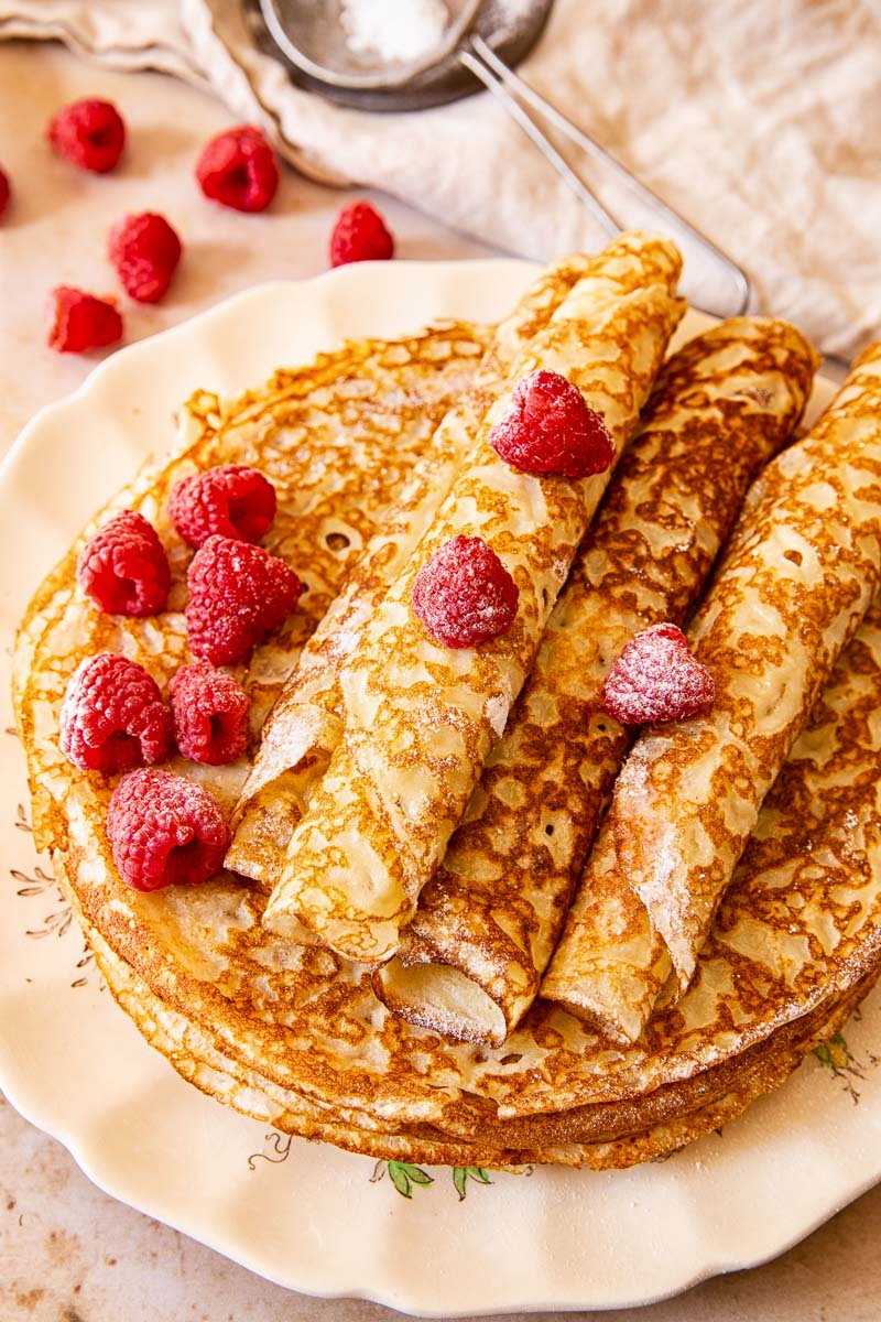 Blini topped with raspberries