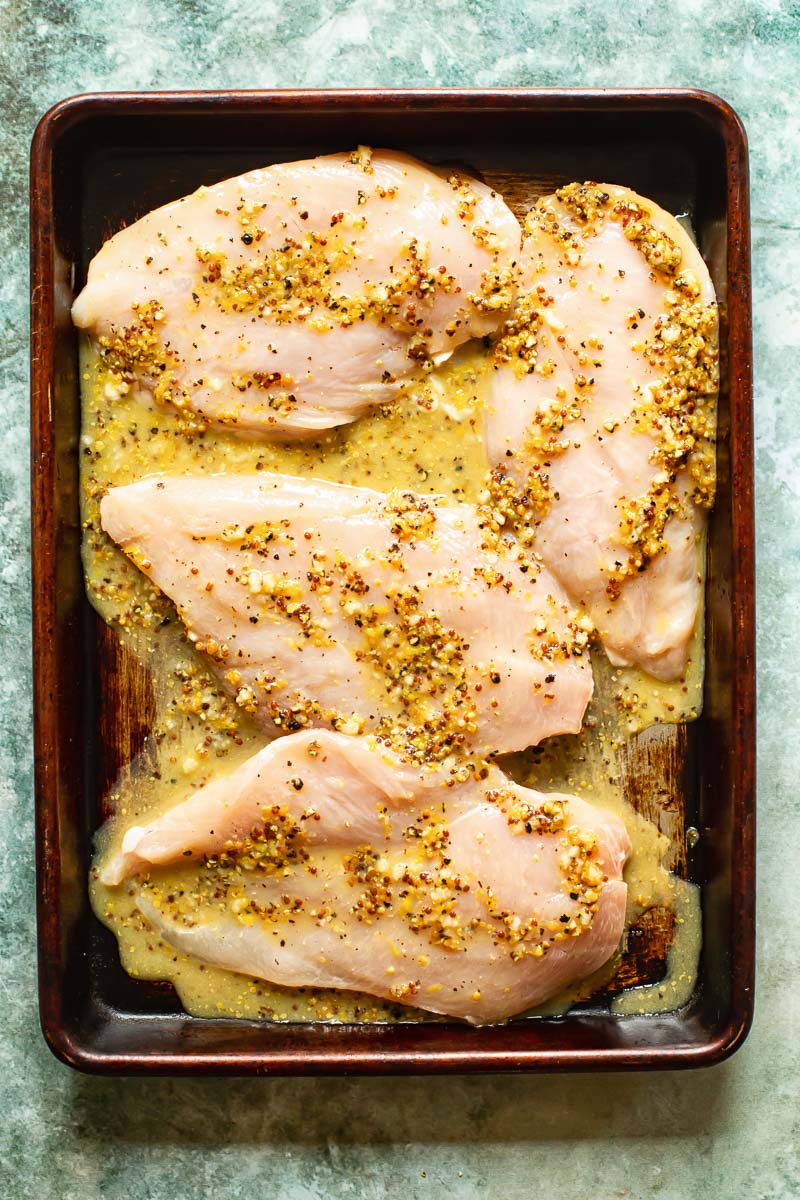 chicken breasts marinating in lemon pepper marinade