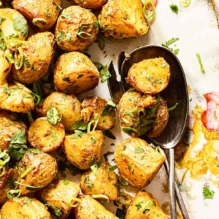 Roasted Baby Potatoes sprinkled with sliced green onions and cilantro