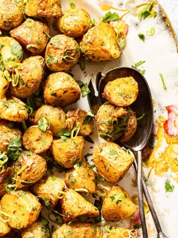Roasted Baby Potatoes sprinkled with sliced green onions and cilantro