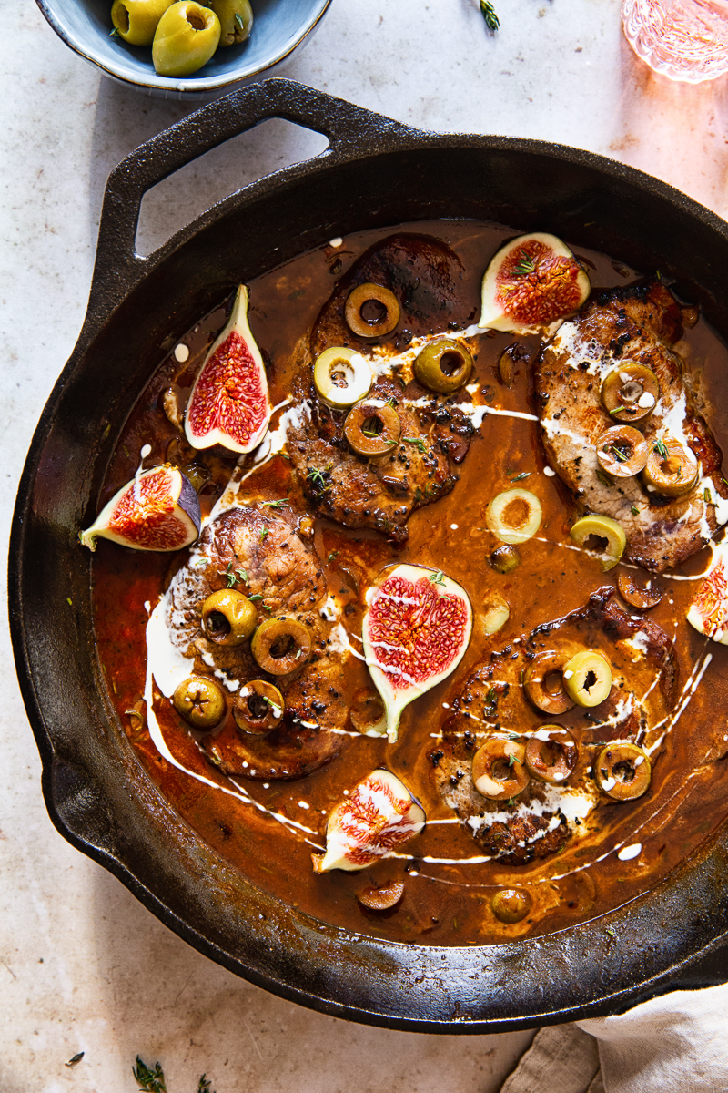 sweet and sour pork loin steaks in sauce with figs