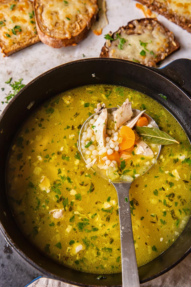 Turkey Soup with giant couscous in pot