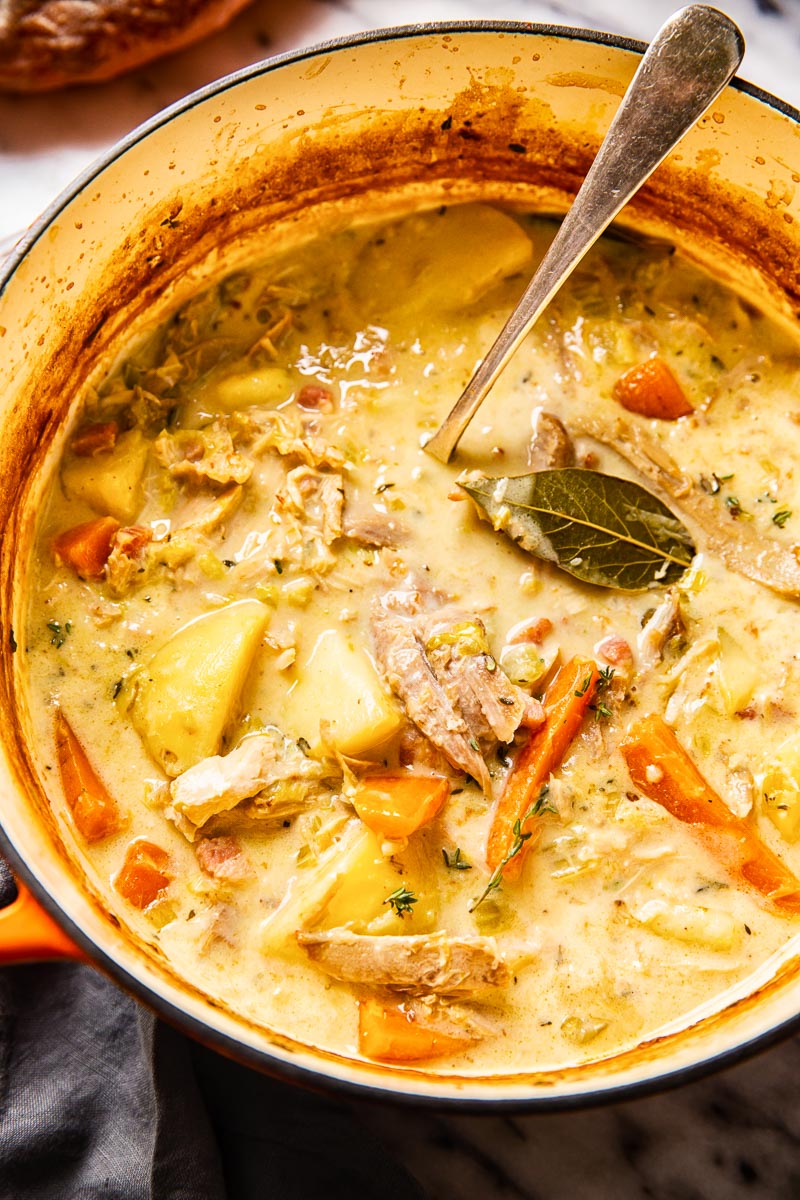 creamy turkey stew with carrots and potatoes in a soup pot