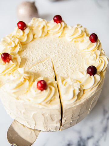 Cranberry Cake with Cream Cheese Icing and topped with fresh cranberries