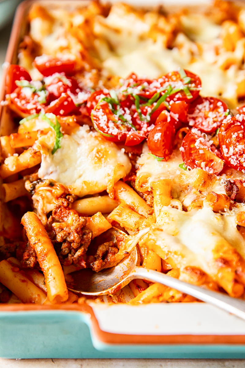 cheesy pasta bake with a spoon in the dish