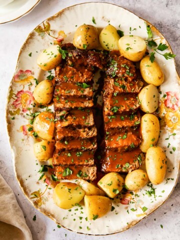 beef brisket and potatoes on platter