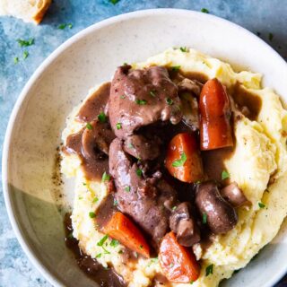 Instant Pot Coq au Vin over mashed potatoes in a bowl