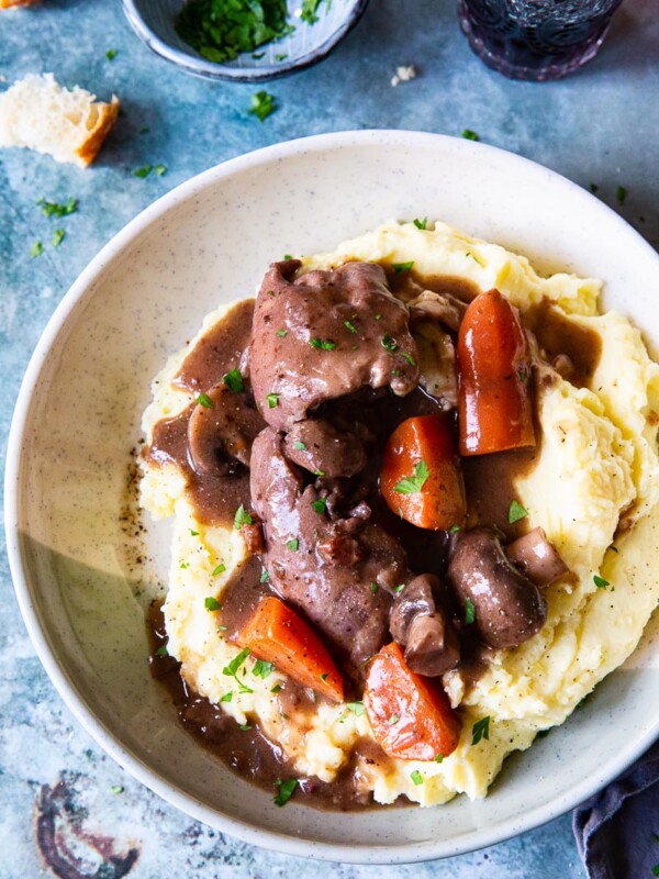 Instant Pot Coq au Vin over mashed potatoes in a bowl