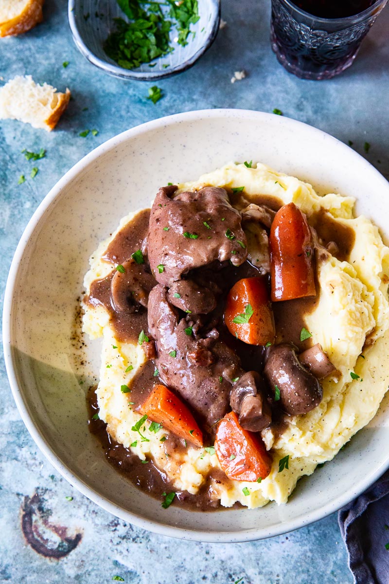 Instant Pot Coq au Vin over mashed potatoes in a bowl