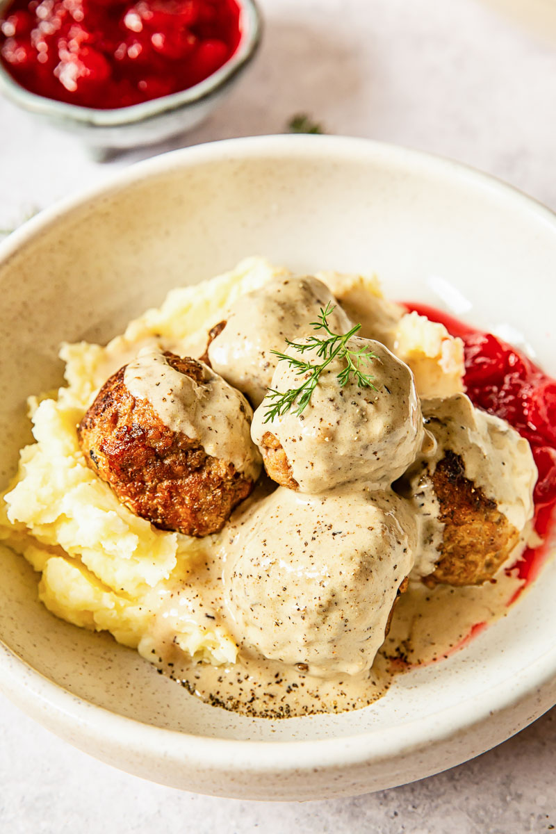 meatballs in sauce over mashed potatoes