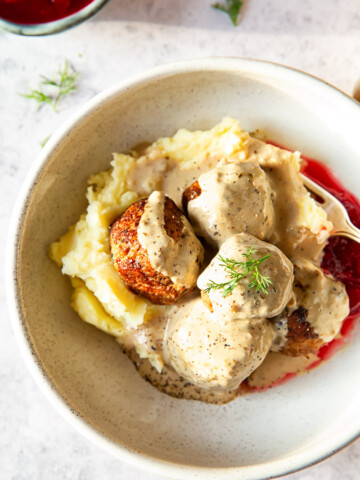 meatballs in cream sauce over mashed potatoes