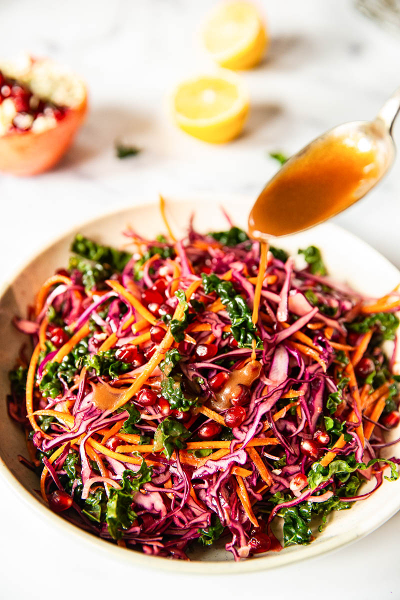 Red Cabbage Slaw with Carrots and Pomegranate in a bowl