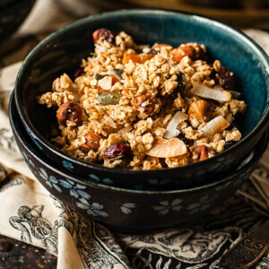 side view homemade granola in a blue bowl