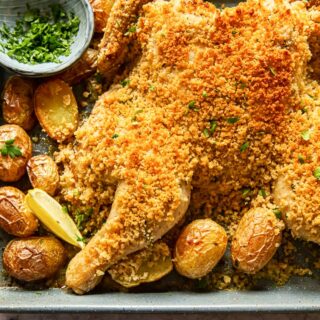 spatchcock chicken coated with breadcrumbs and roast potatoes