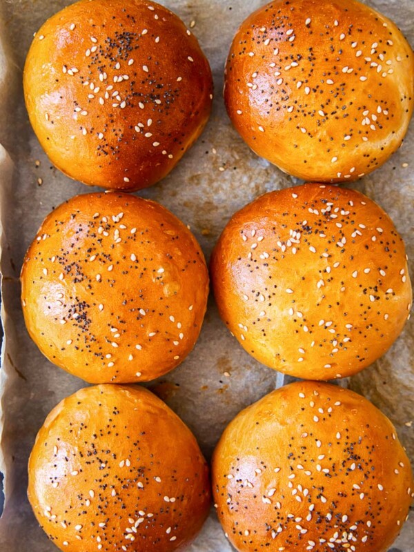 bread rolls sprinkled with poppy seeds and sesame seeds