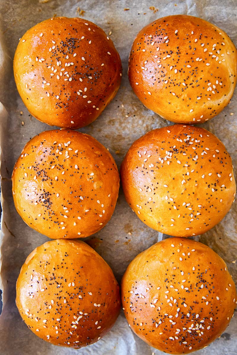 bread rolls sprinkled with poppy seeds and sesame seeds