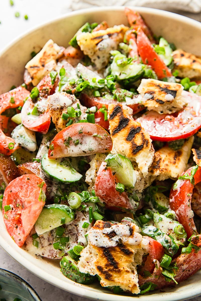 Lebanese salad with tomatoes and cucumber in tangy buttermilk dressing