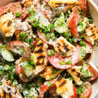 tomato and cucumber salad with grilled pita