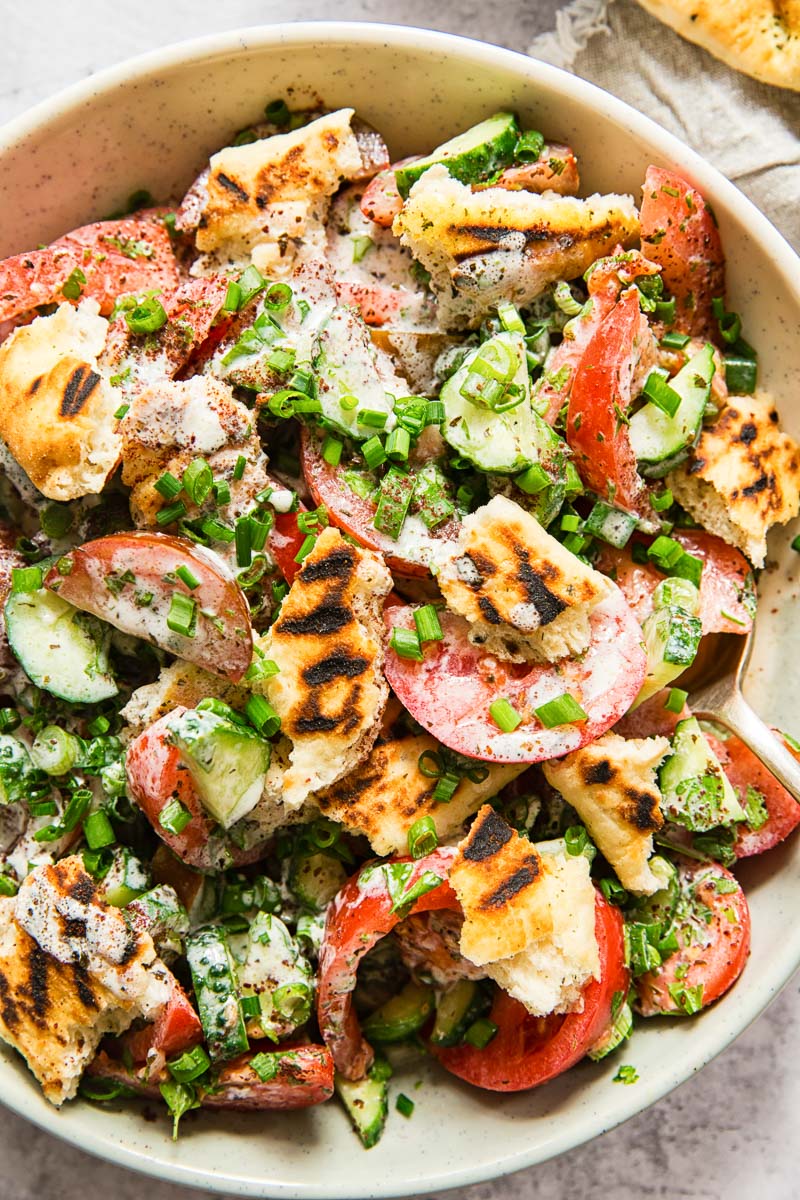 tomato and cucumber salad with grilled pita