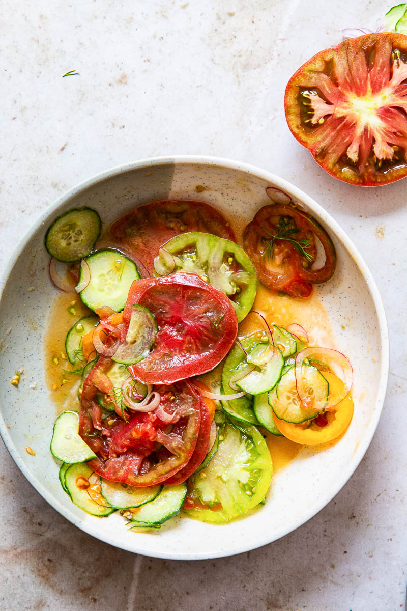 heirloom tomato and cucumber salad in a bowl