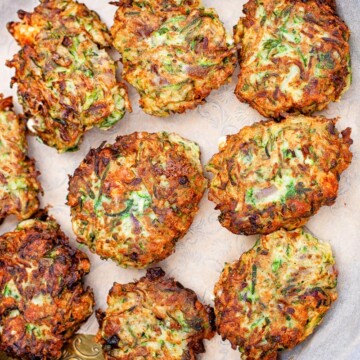 zucchini fritters on bronze platter