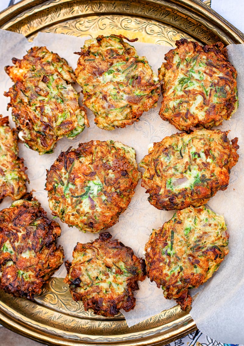 zucchini fritters on bronze platter