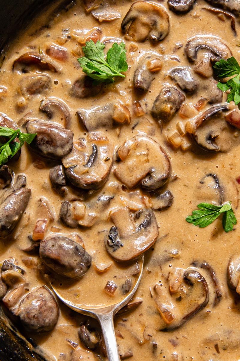 halved mushrooms in creamy sauce