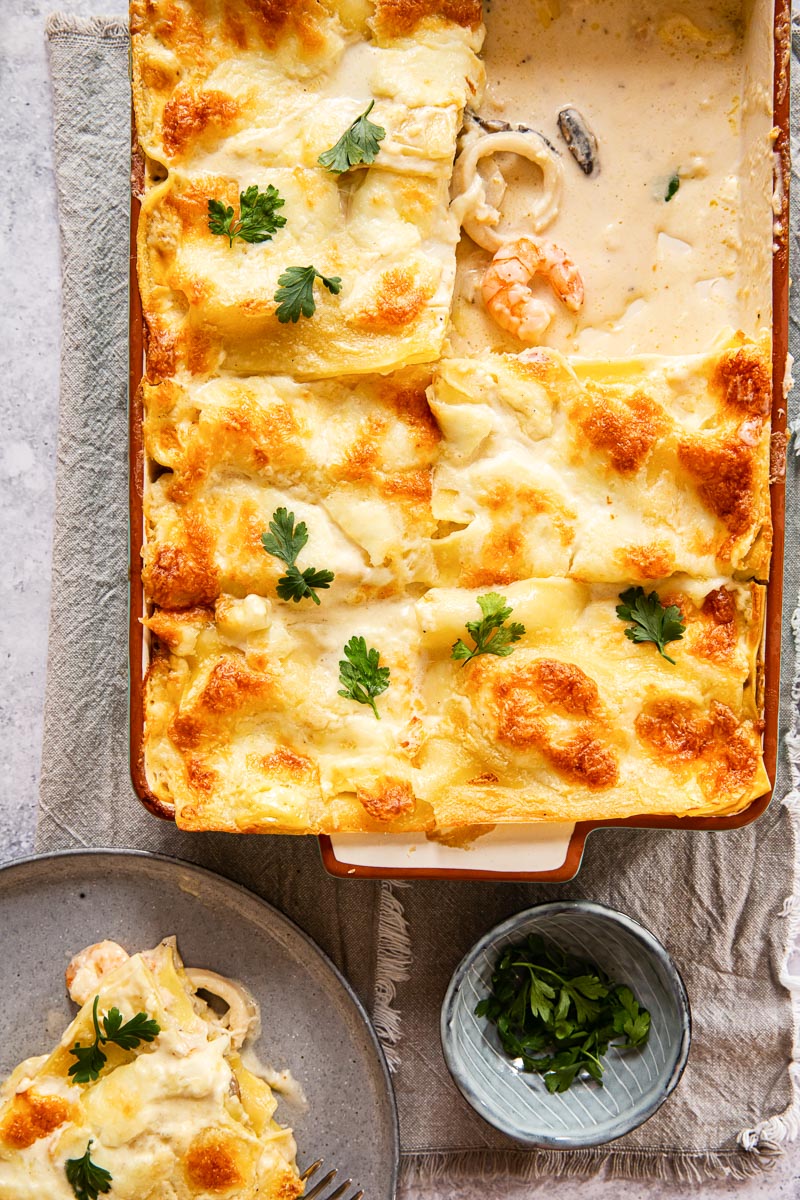 top down view of white lasagna with seafood showing