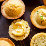 corn muffins on dark brown background