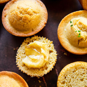 corn muffins on dark brown background