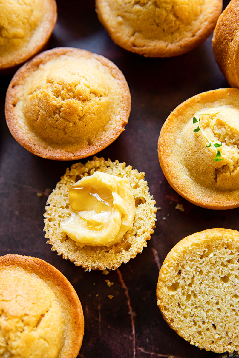 corn muffins on dark brown background