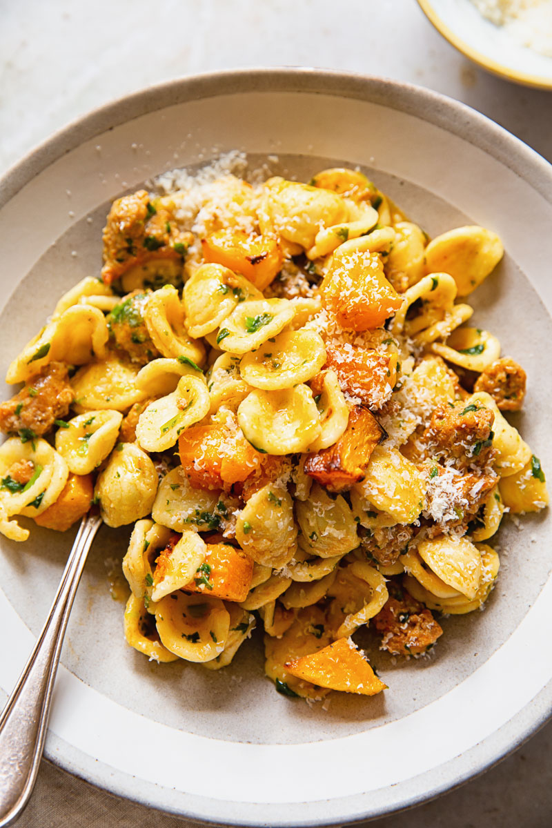 pasta with roasted butternut squash in cream bowl