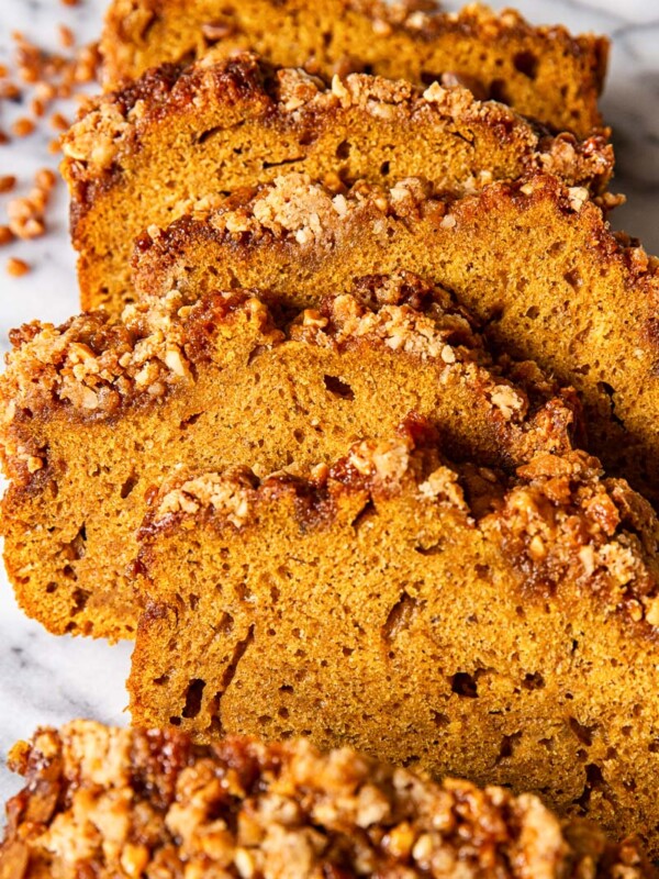 sliced pumpkin bread on marble countertop