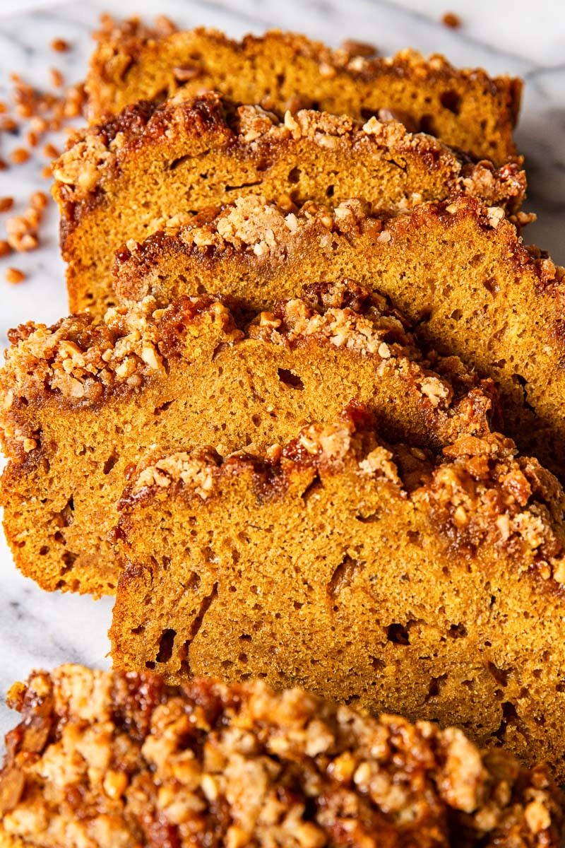 sliced pumpkin bread on marble countertop