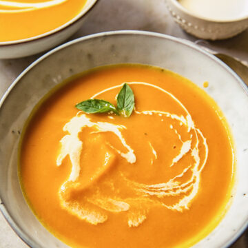 blended butternut squash soup with cream swirls