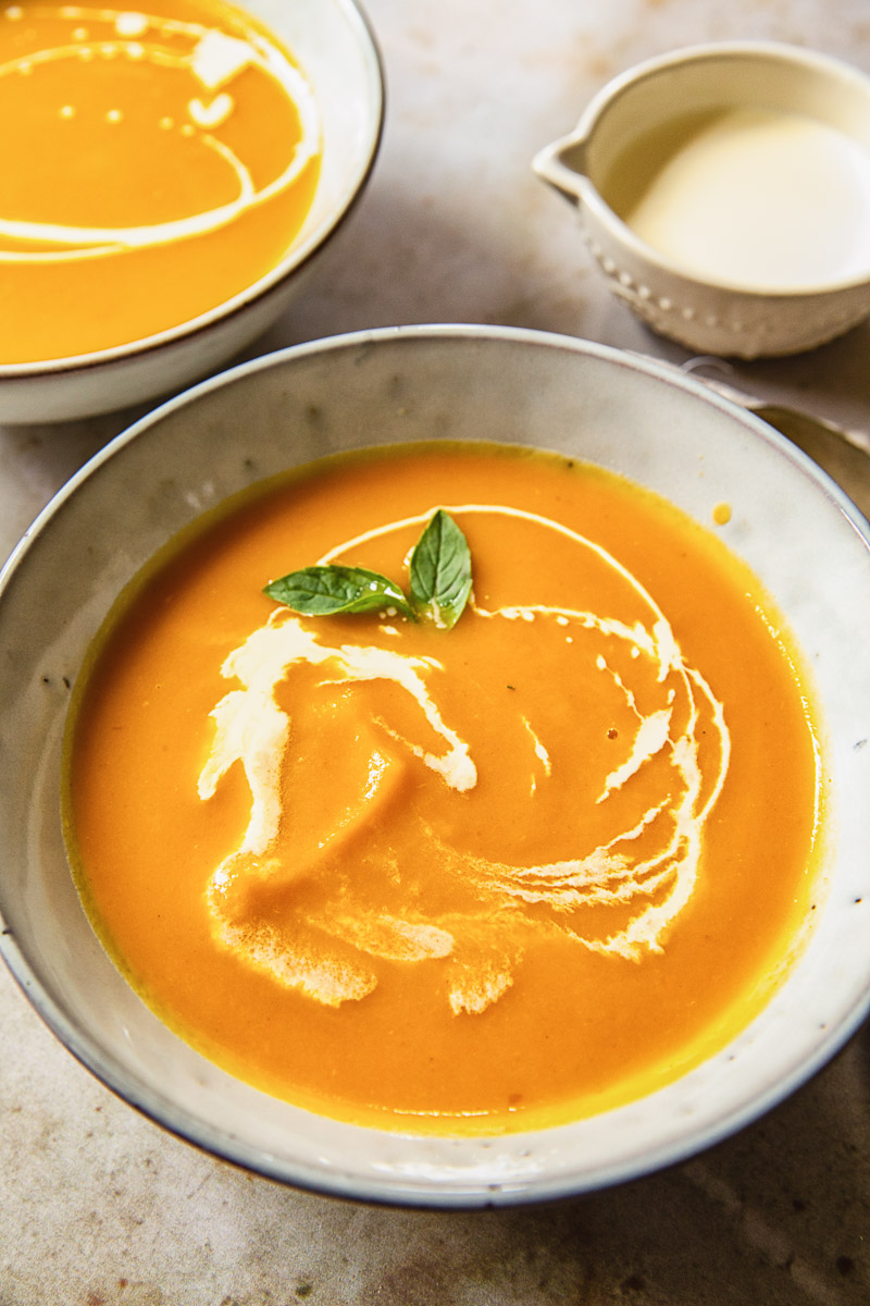 blended butternut squash soup with cream swirls