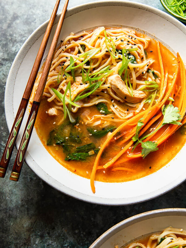 Chicken noodle soup in bowl with chopsticks